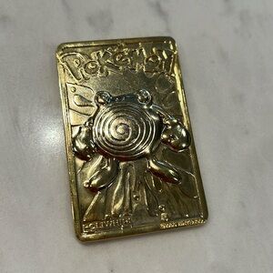 23K Gold Poliwhirl Pokémon card from 1999 vintage Nintendo comes with C of A